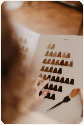 Professional hair styling example showing elegant cut and color